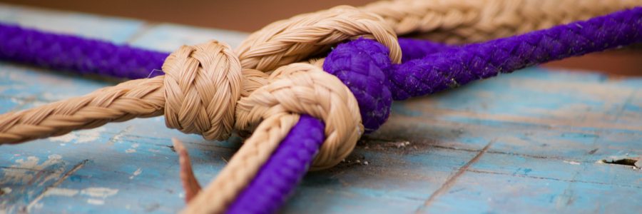 brown rope on blue wooden table