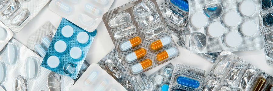 a pile of pills sitting next to each other on top of a table